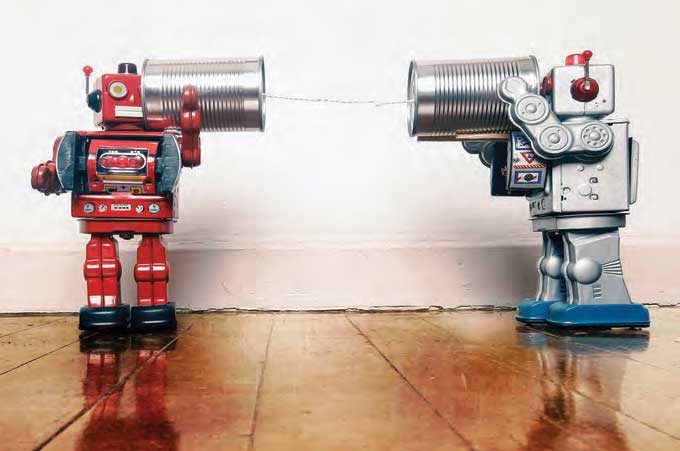 Toy robots using a tin can communicator