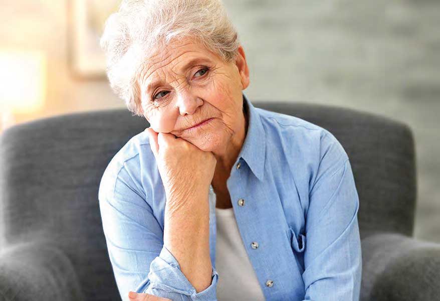 Retired woman looking sad