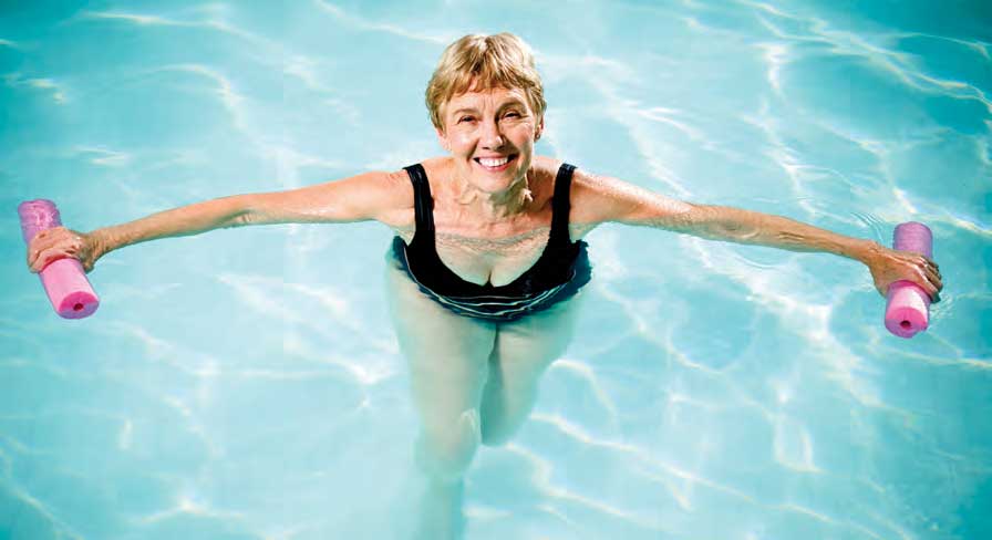 woman exercising in a pool