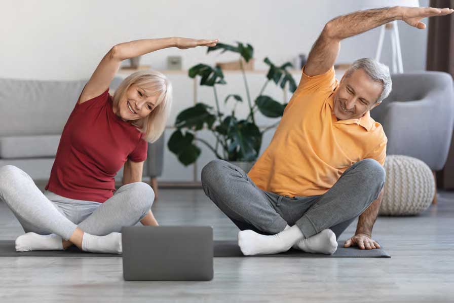 Couple stretching on the floor