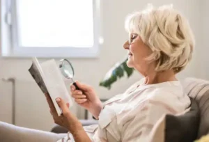 Woman using magnifying glass
