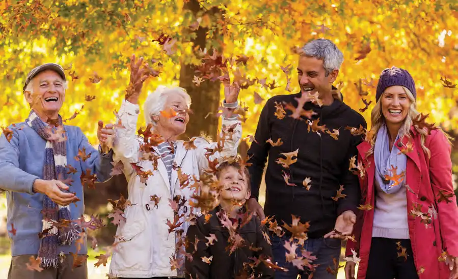 family in the autumn leaves