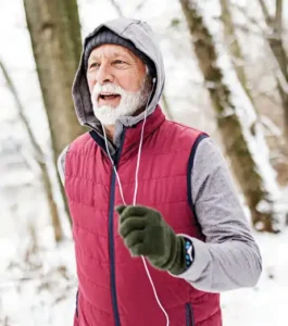 Man hiking in the woods in the snow