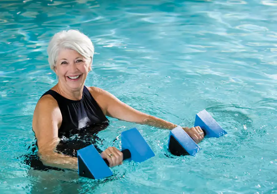 woman doing water aerobics in the pool