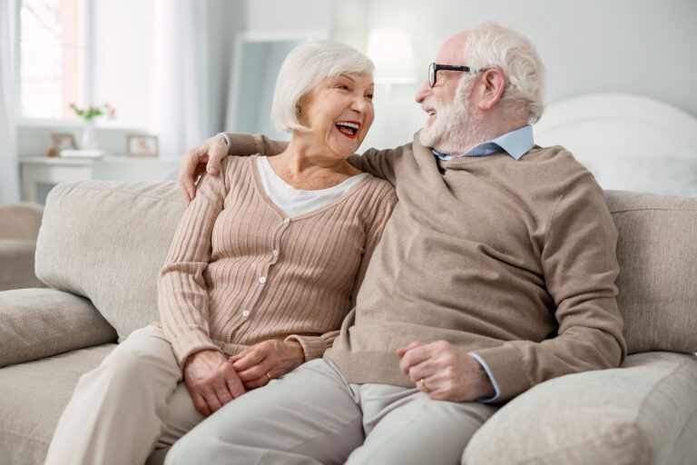 Senior husband and wife discuss the benefits of independent living for seniors
