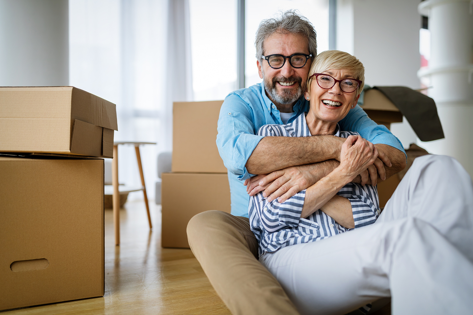 A senior man and woman downsizing for retirement
