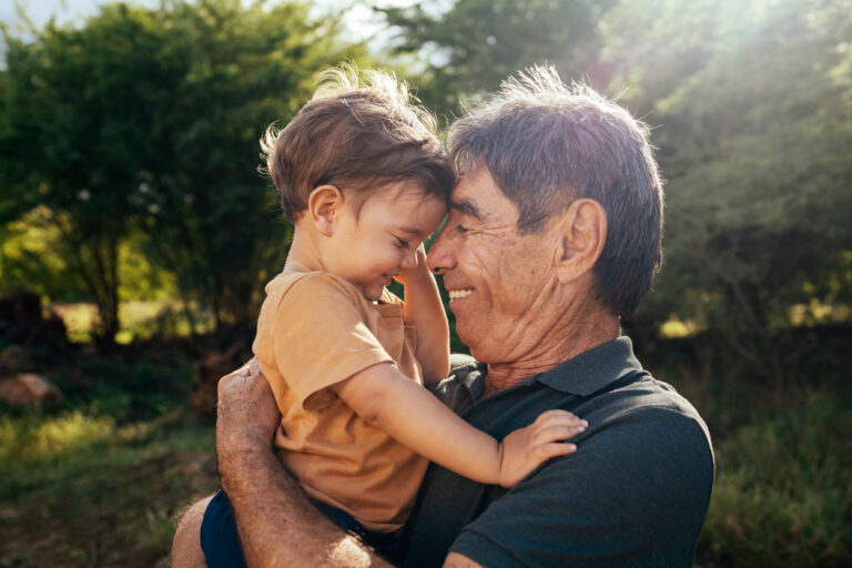 Senior man plays with granddaughter