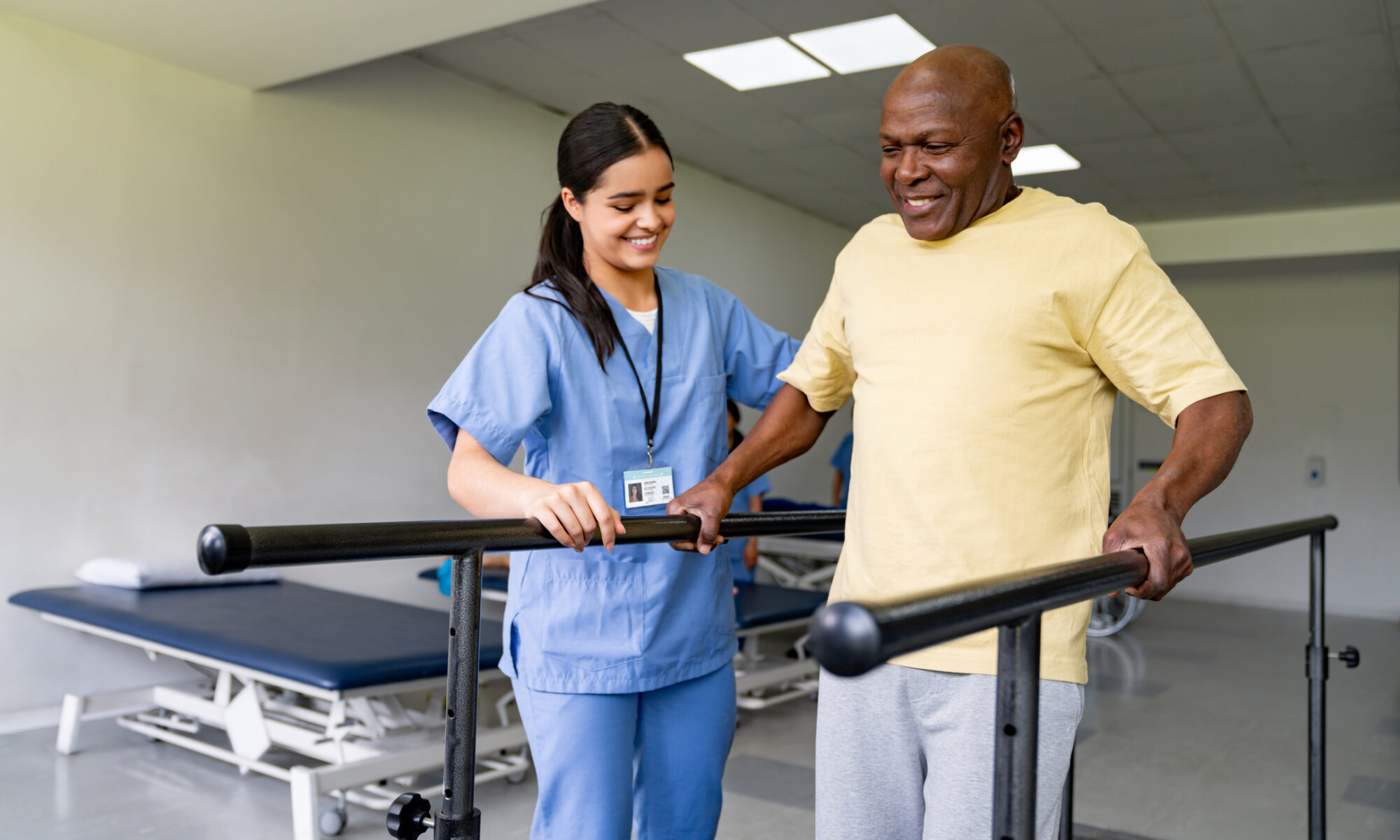 Physical therapist helps older adult at senior rehabilitation center
