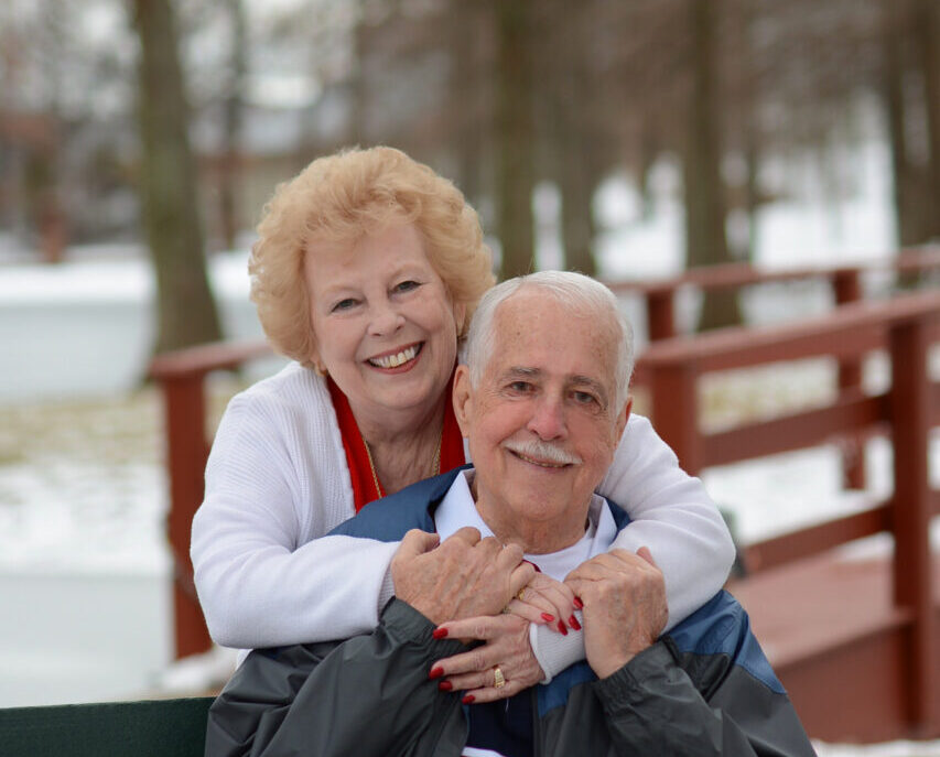 man and woman on bench in the winter