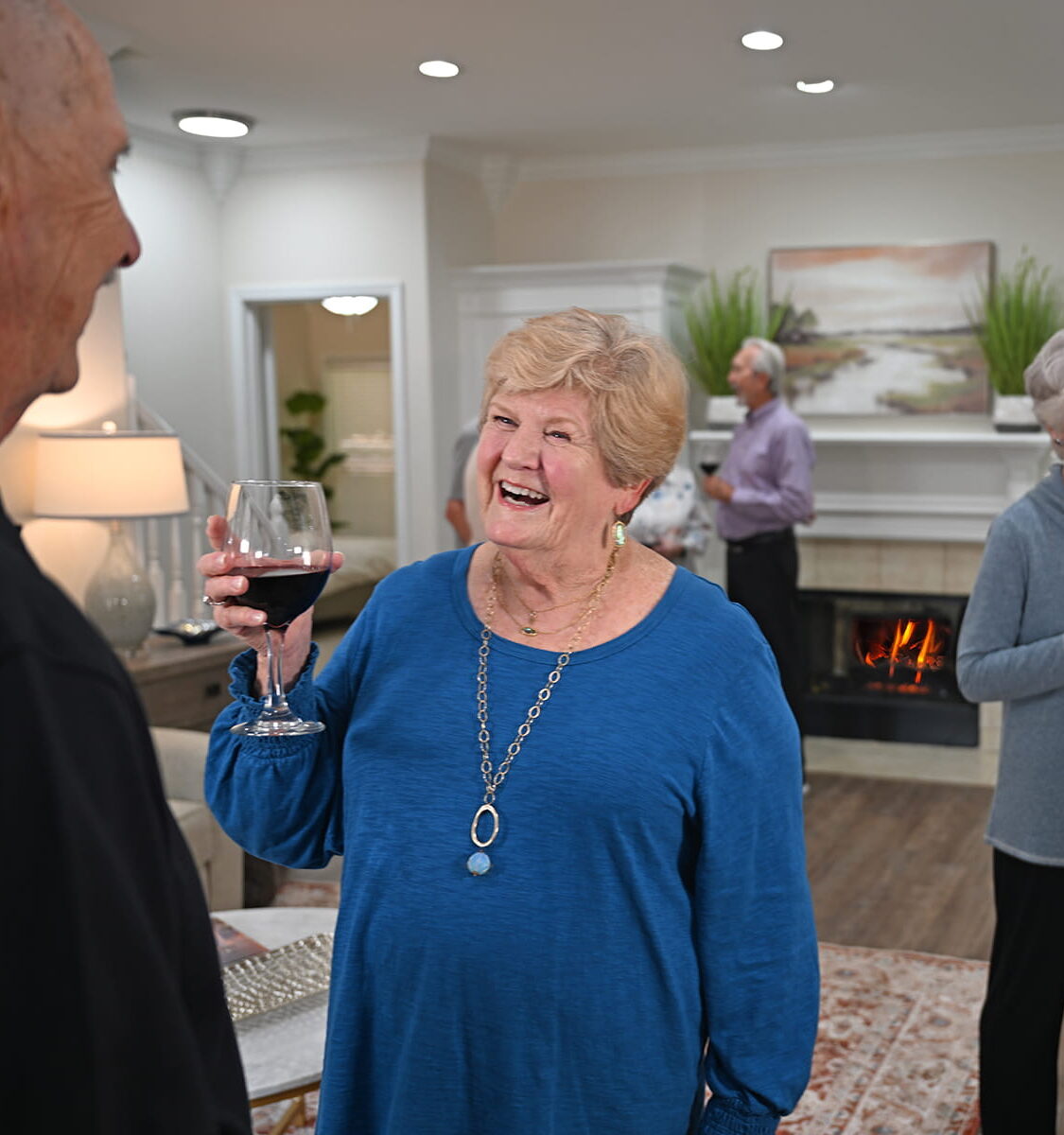 woman holding glass of wine