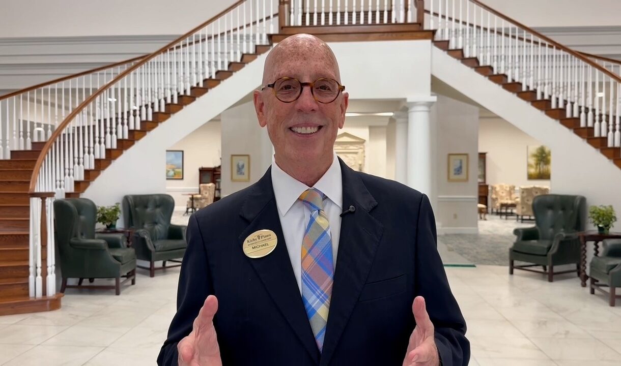 bald senior man in suit