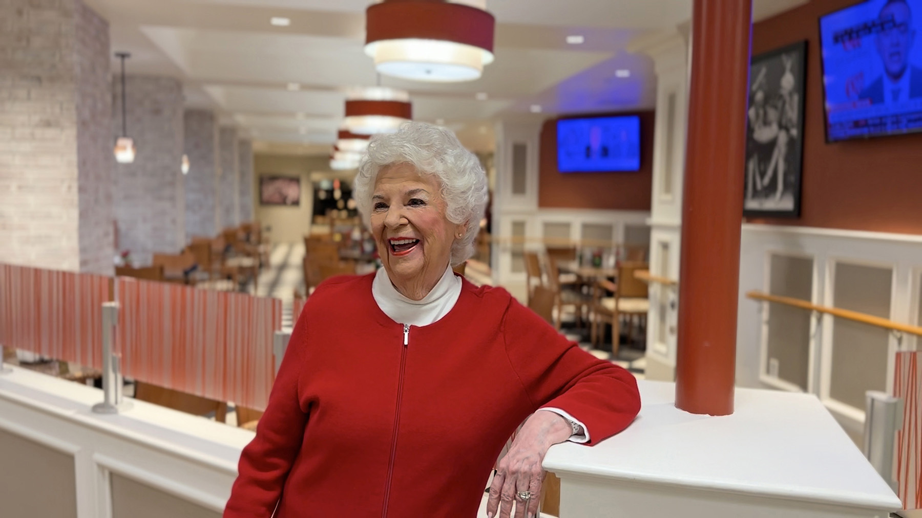 senior woman in red sweater