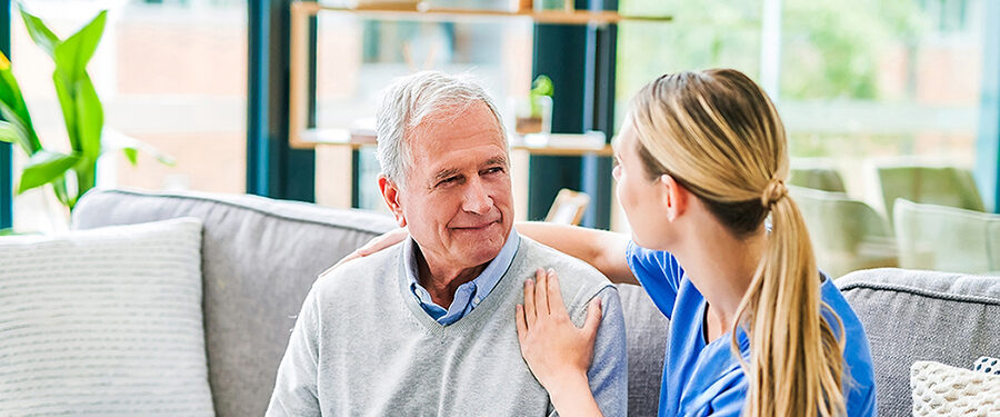 Shot of a young female doctor comforting a senior patient at a clinic