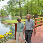 seniors walking on bridge